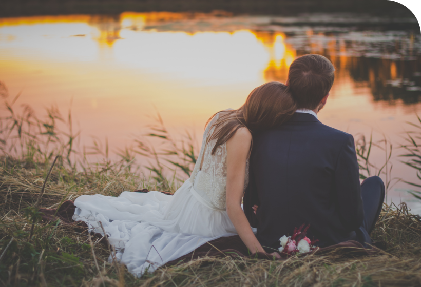 Couple by Water at Sunset